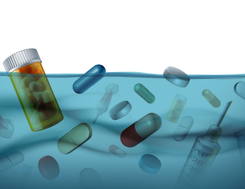 Un groupe de pilules et de médicaments qui flottent dans l'eau.